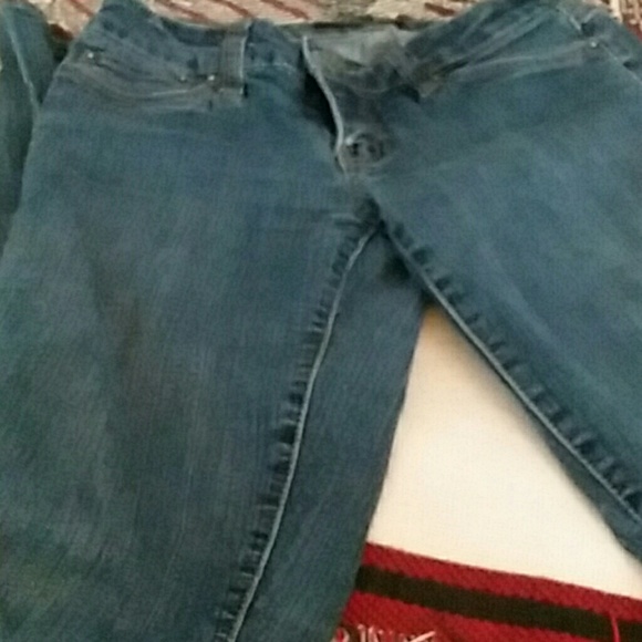 Seductions Pants - A pair of blue skinny jeans .